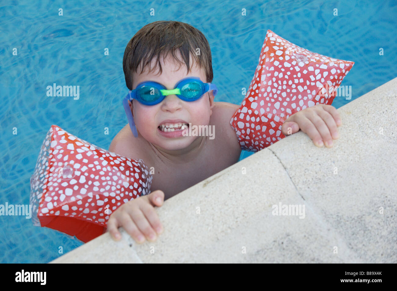 photo of an adorable boy learning to swim Stock Photo Alamy
