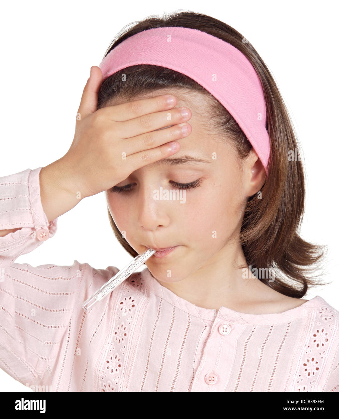 Adorable girl whit thermometer on a over white background Stock Photo