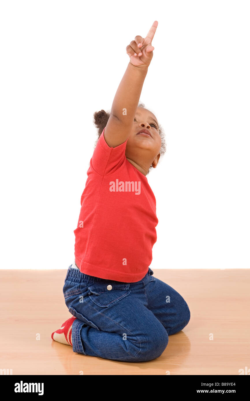 African baby on knees with his finger pointing Stock Photo Alamy