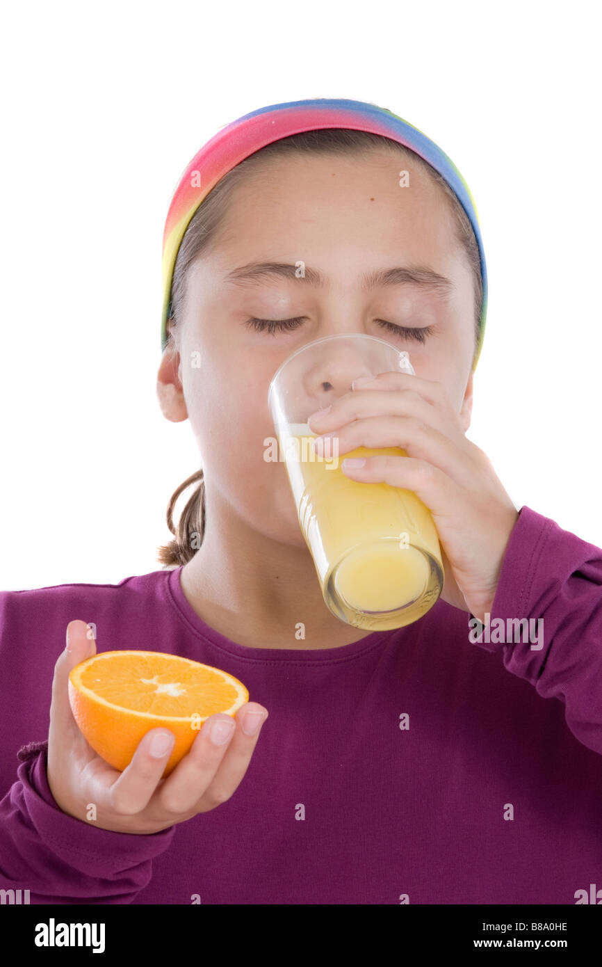 Cute girl drinking a juice of orange on a over white background Stock ...