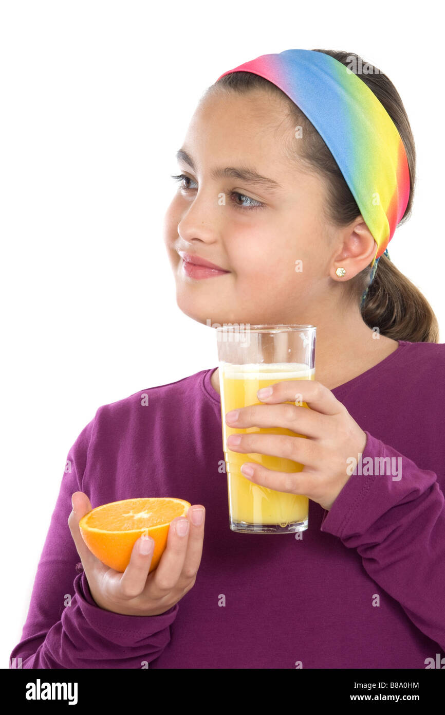 Cute girl drinking juice of oranges a over white background Stock Photo ...