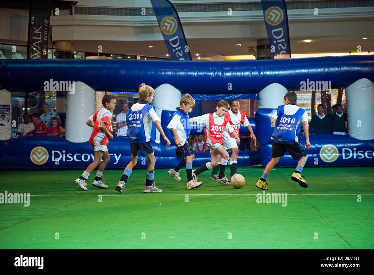 Boys playing in an indoor soccer competition at Canal Walk Mall in Cape Town South Africa Stock Photo