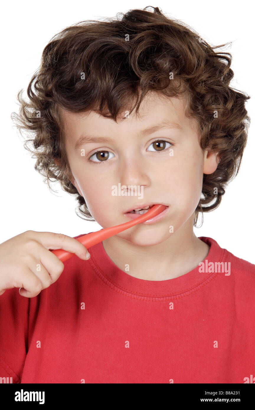 adorable child cleaning the teeth a over white background Stock Photo