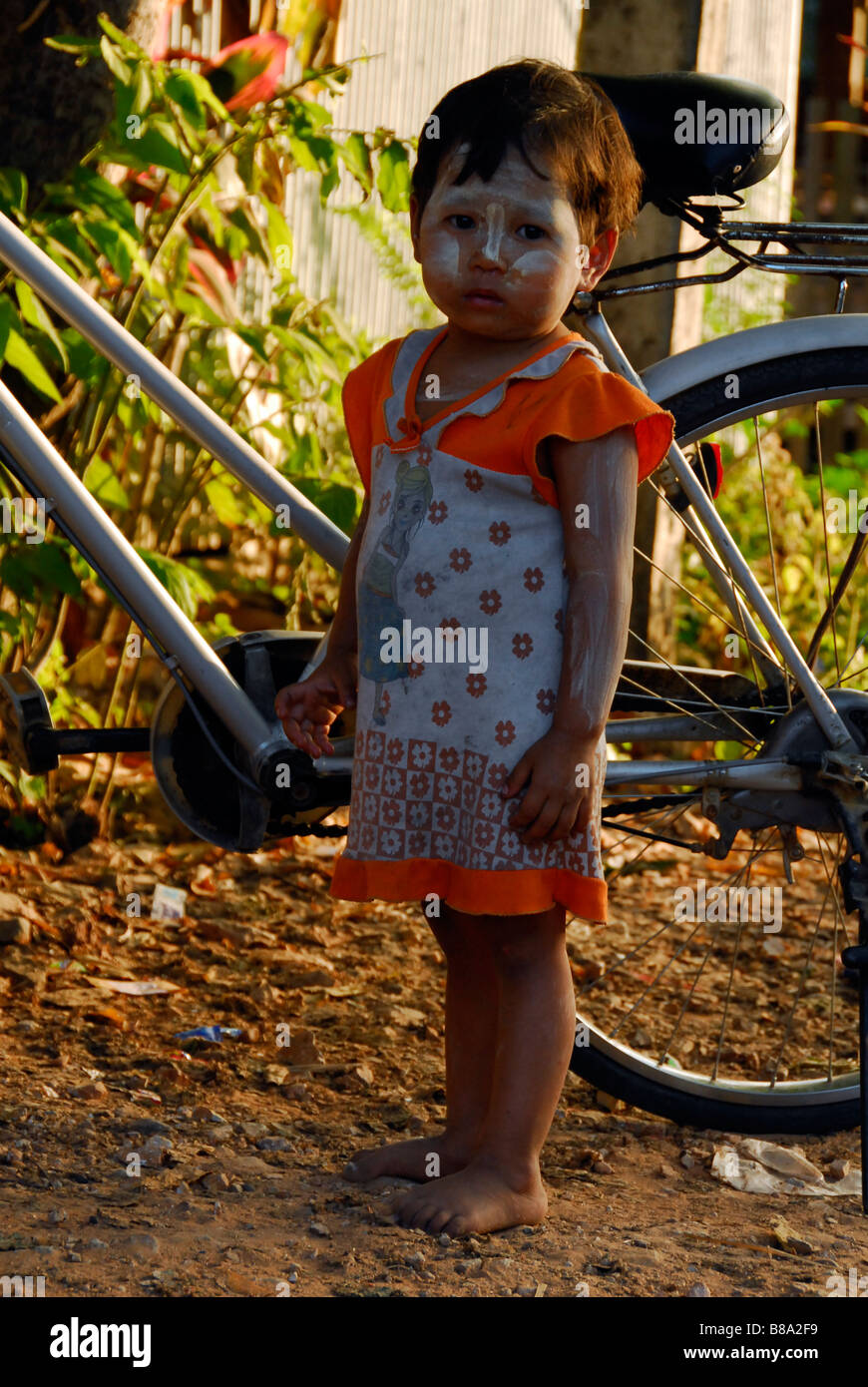 Burmese little girl with tanaka powder on her cute face,Tak,Northern Thailand. Stock Photo