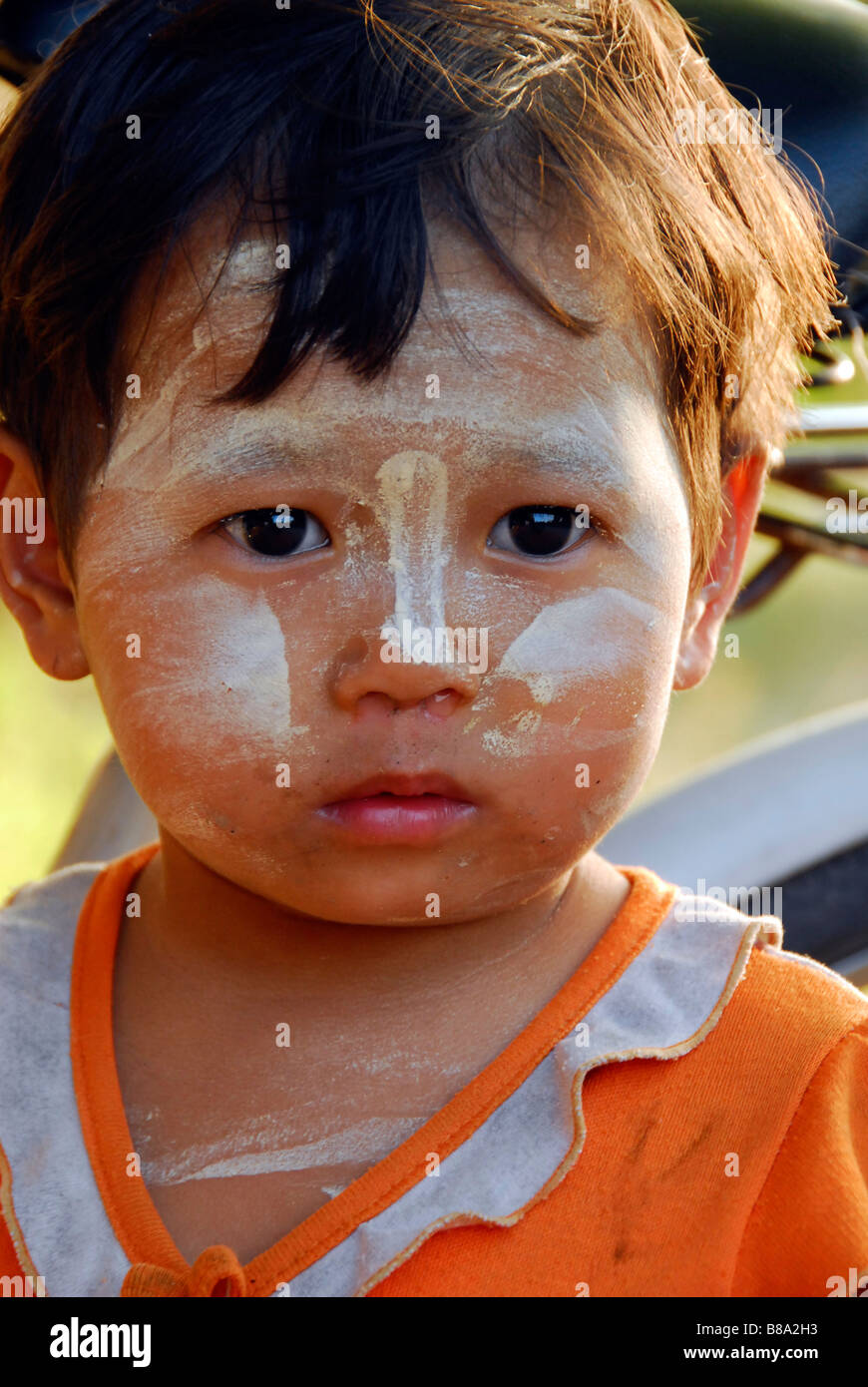 Burmese little girl with tanaka powder on her cute face,Tak,Northern Thailand. Stock Photo