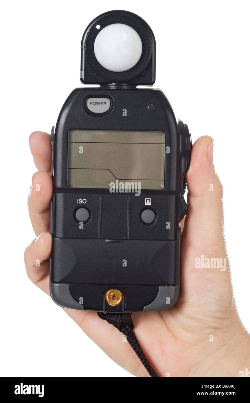 hands with a photometer to measure the light in the scene Stock Photo