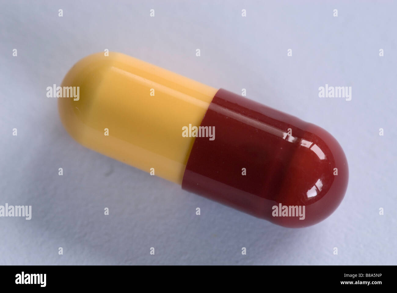 Yellow and red capsule Stock Photo Alamy