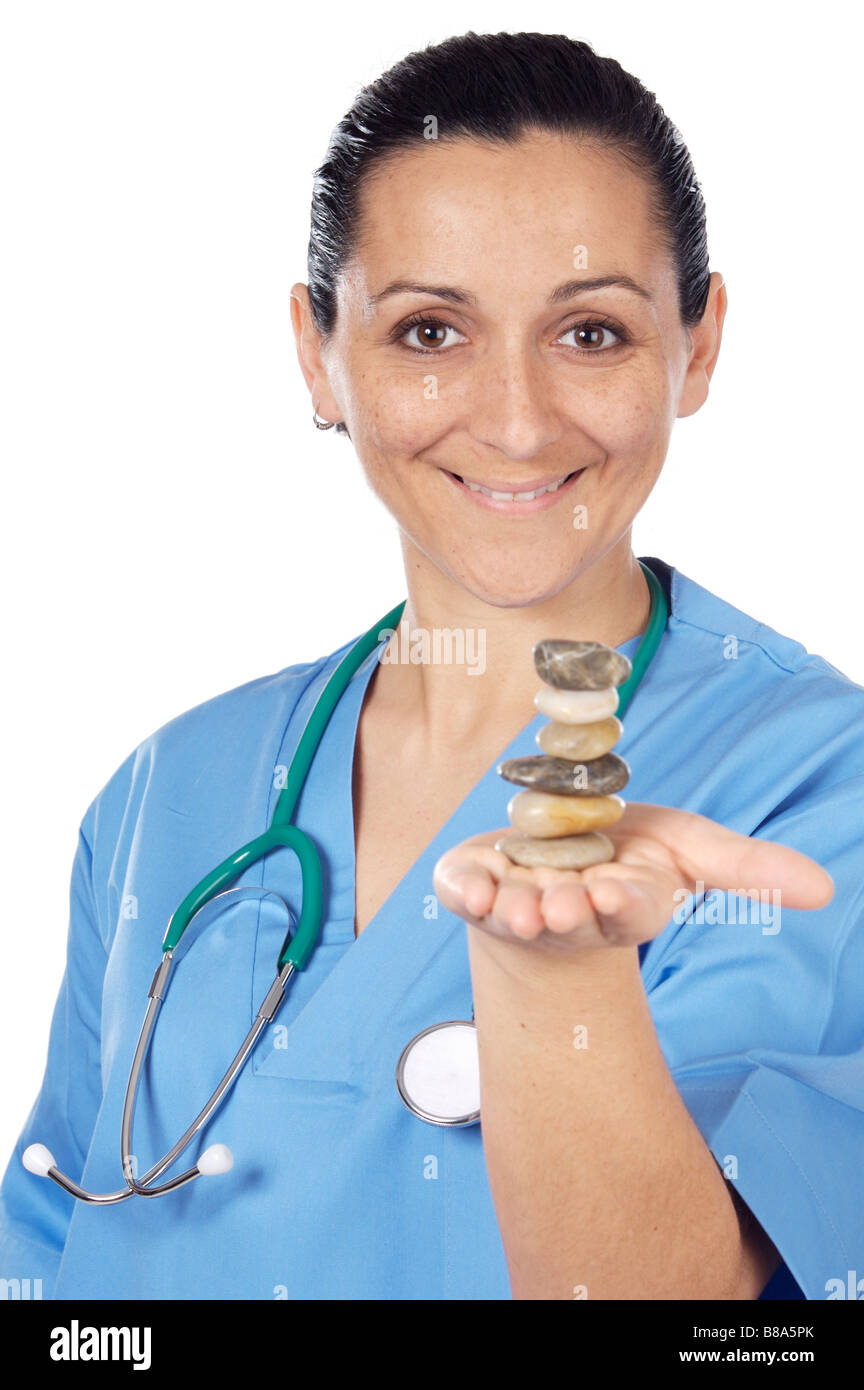 Beautiful medical staff member with balanced stones Stock Photo Alamy