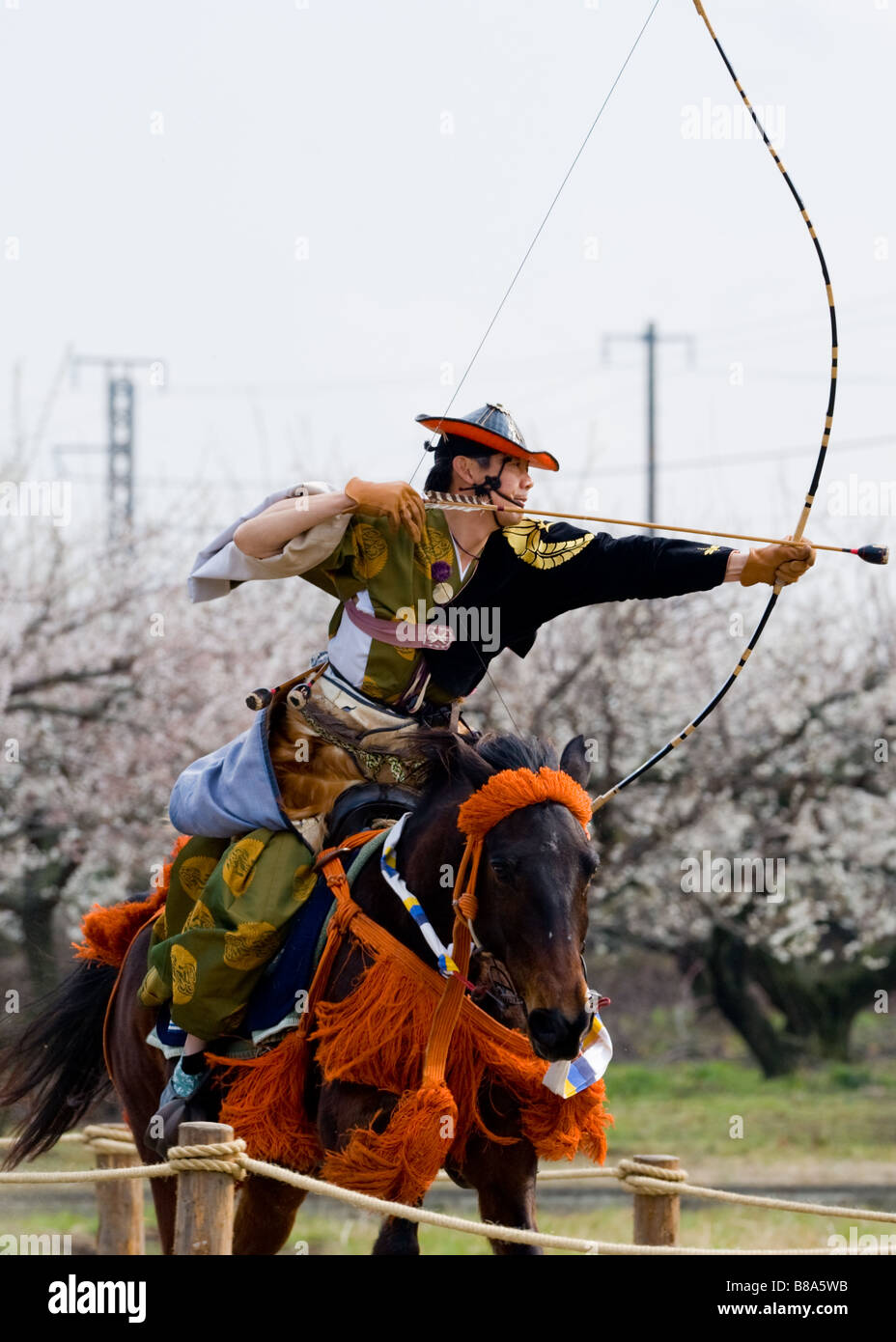 Japanese Horseback Archer takes aim against a backdrop of Plum Blossoms