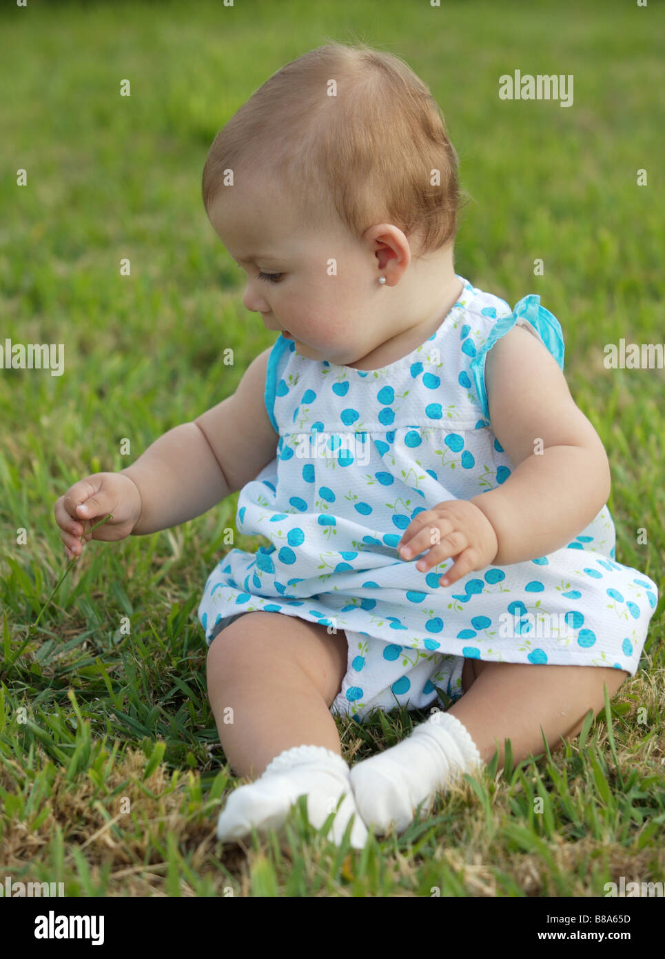 adorable happy baby on the green grass Stock Photo - Alamy