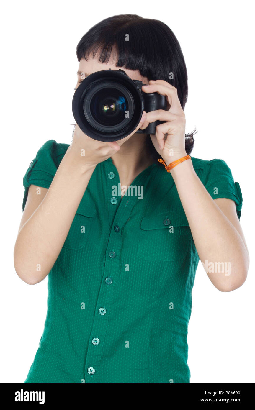 Pretty girl taking a photograph with camera Stock Photo Alamy