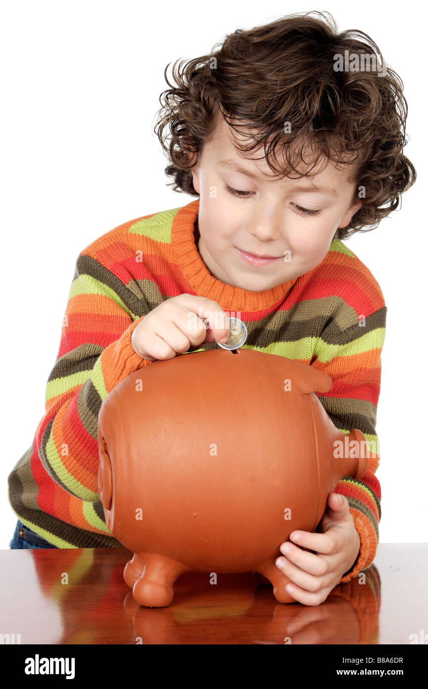 adorable boy putting its savings in your money box Stock Photo Alamy