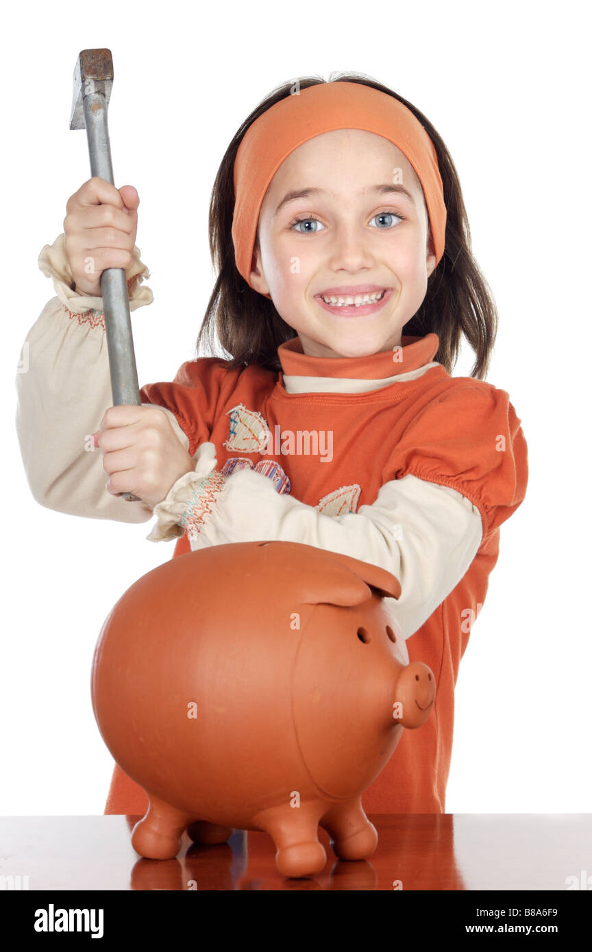 photo of an adorable boy breaking the money box Stock Photo Alamy
