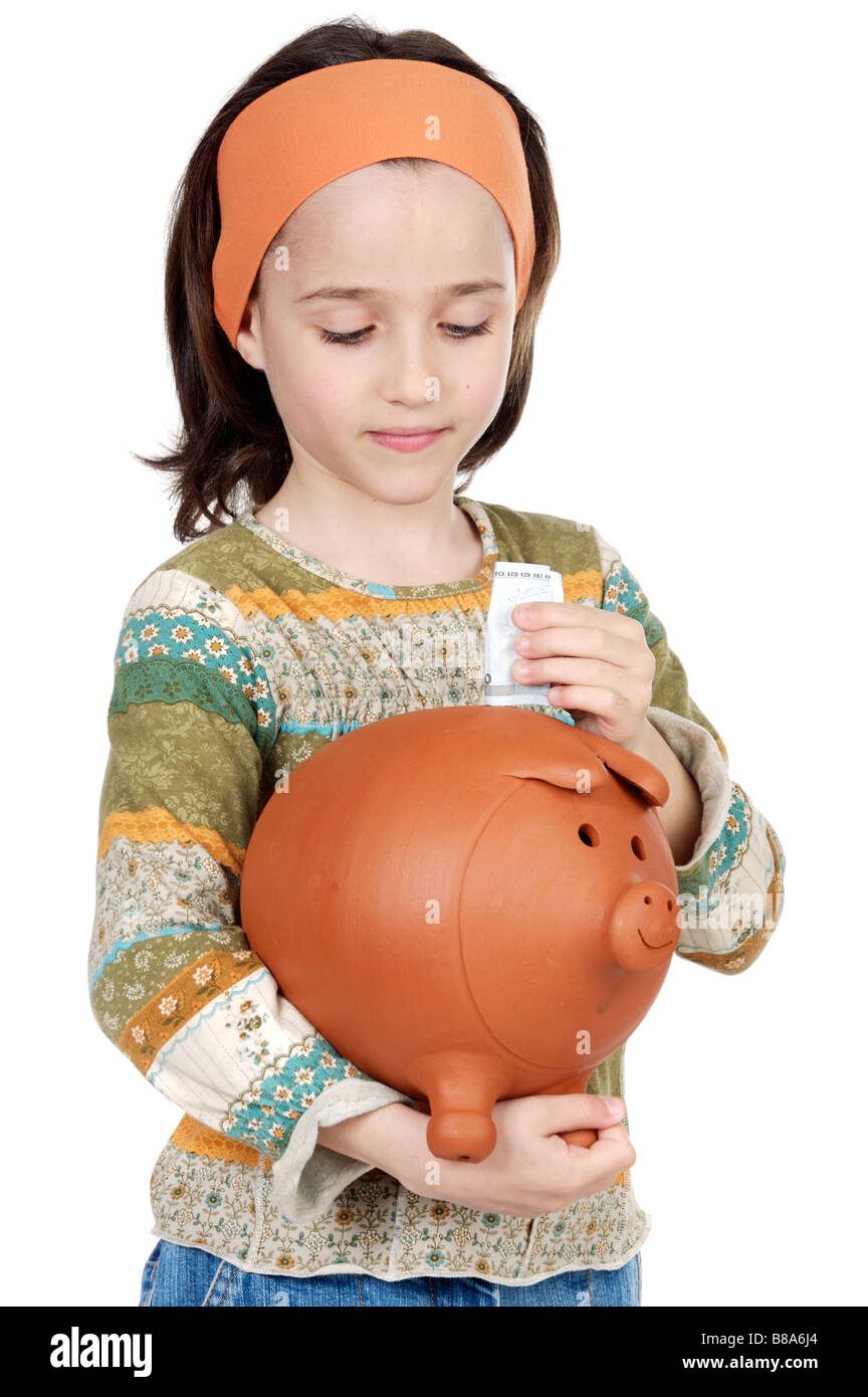 adorable girl putting its savings in your money box Stock Photo Alamy