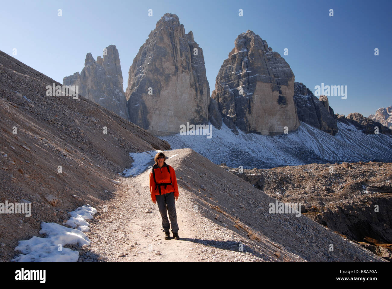 Hiker in front of Tre Cime di Lavaredo Dolomites italy Stock Photo