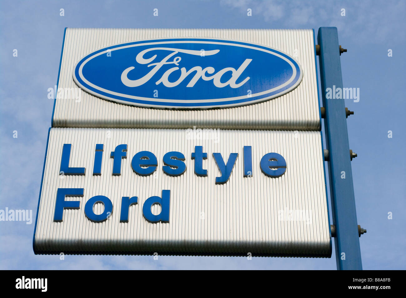 Ford Car Dealers Retailers Sign Against a Blue Sky 'lifestyle ford' Stock Photo