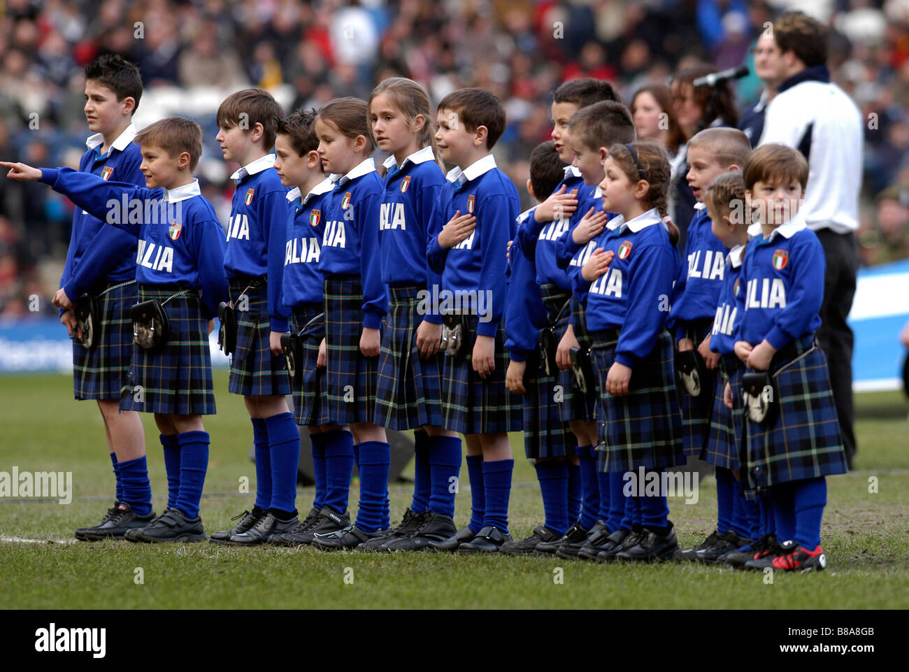 Italian schoolchildren at Murrayfield in Scots dress Stock Photo