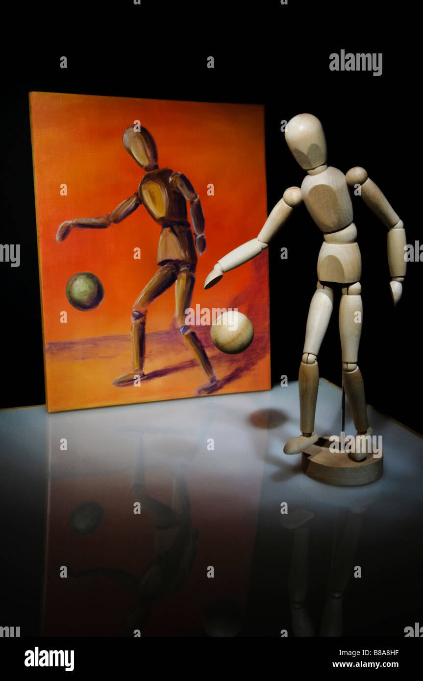 Oil painting with a posed wooden art manikin, an artistic still life arrangement Stock Photo