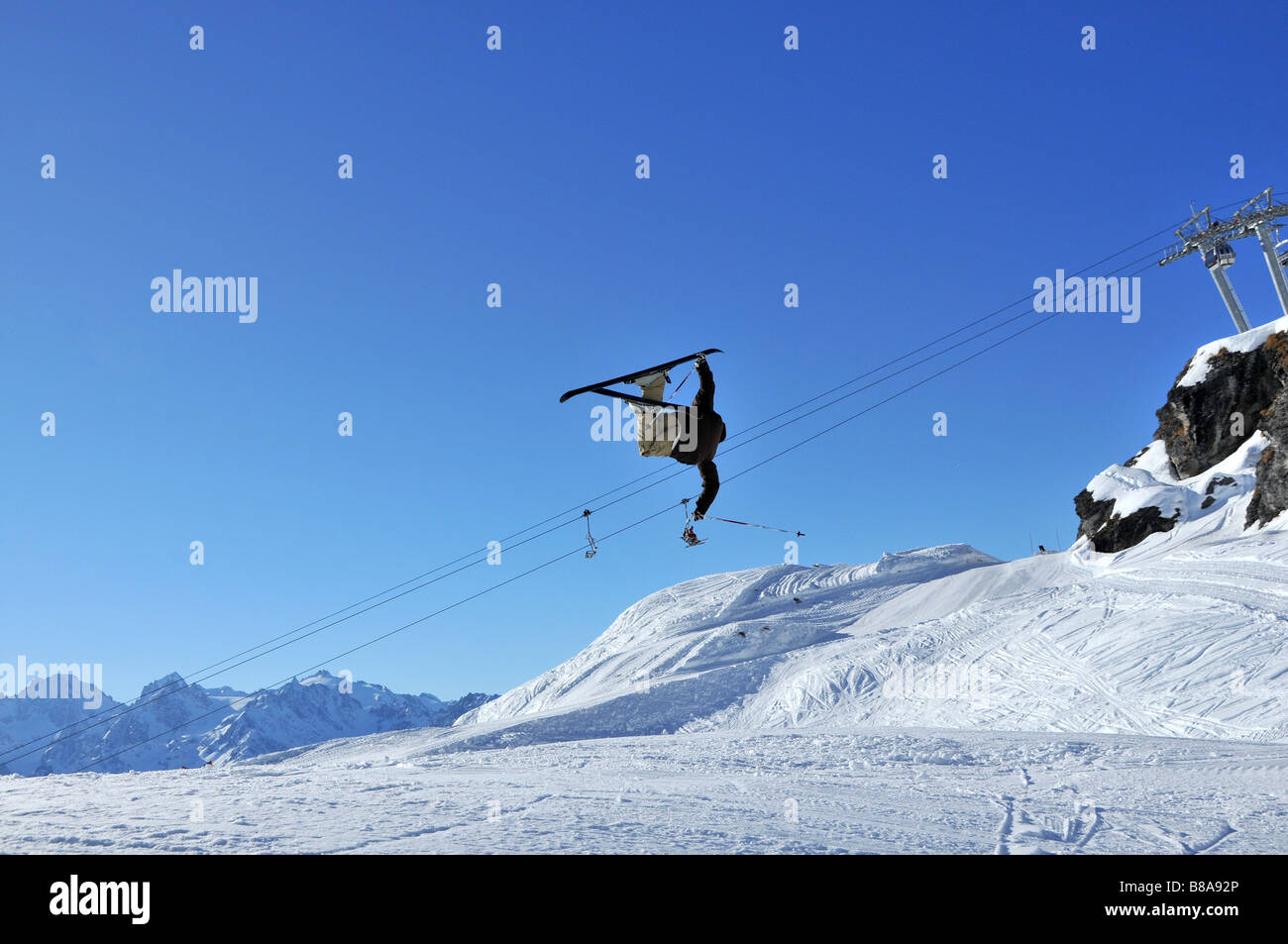 a skier upside down during a jump Stock Photo