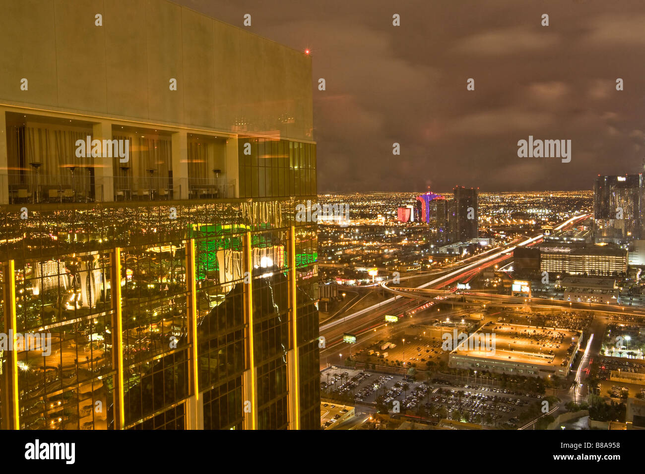 Aerial view of the Las Vegas Strip at night, Las Vegas, Nevada reflecting in the side of The Hotel at the Mandalay Bay Stock Photo