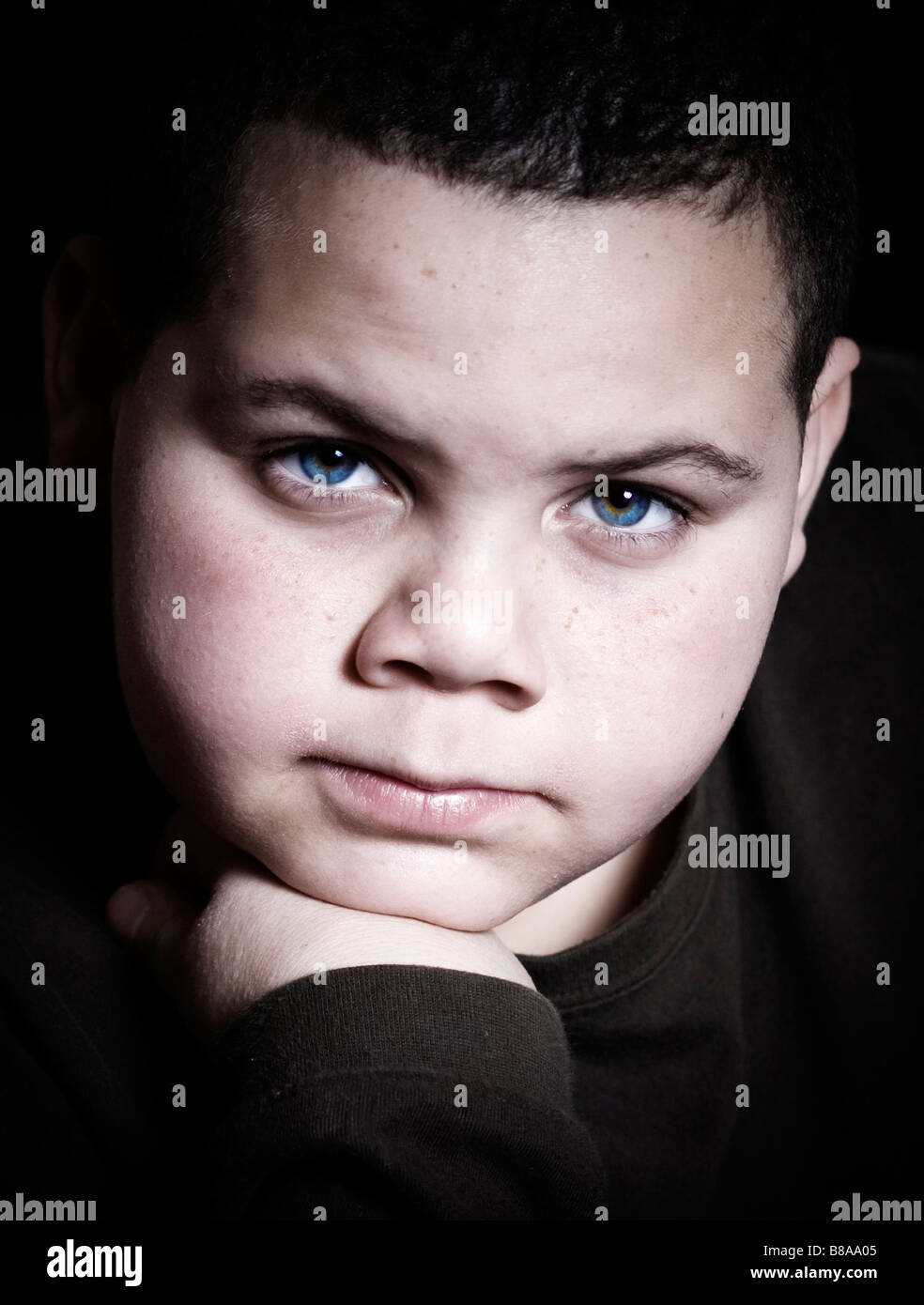 Teenage boy portrait staring at camera with intensity Stock Photo