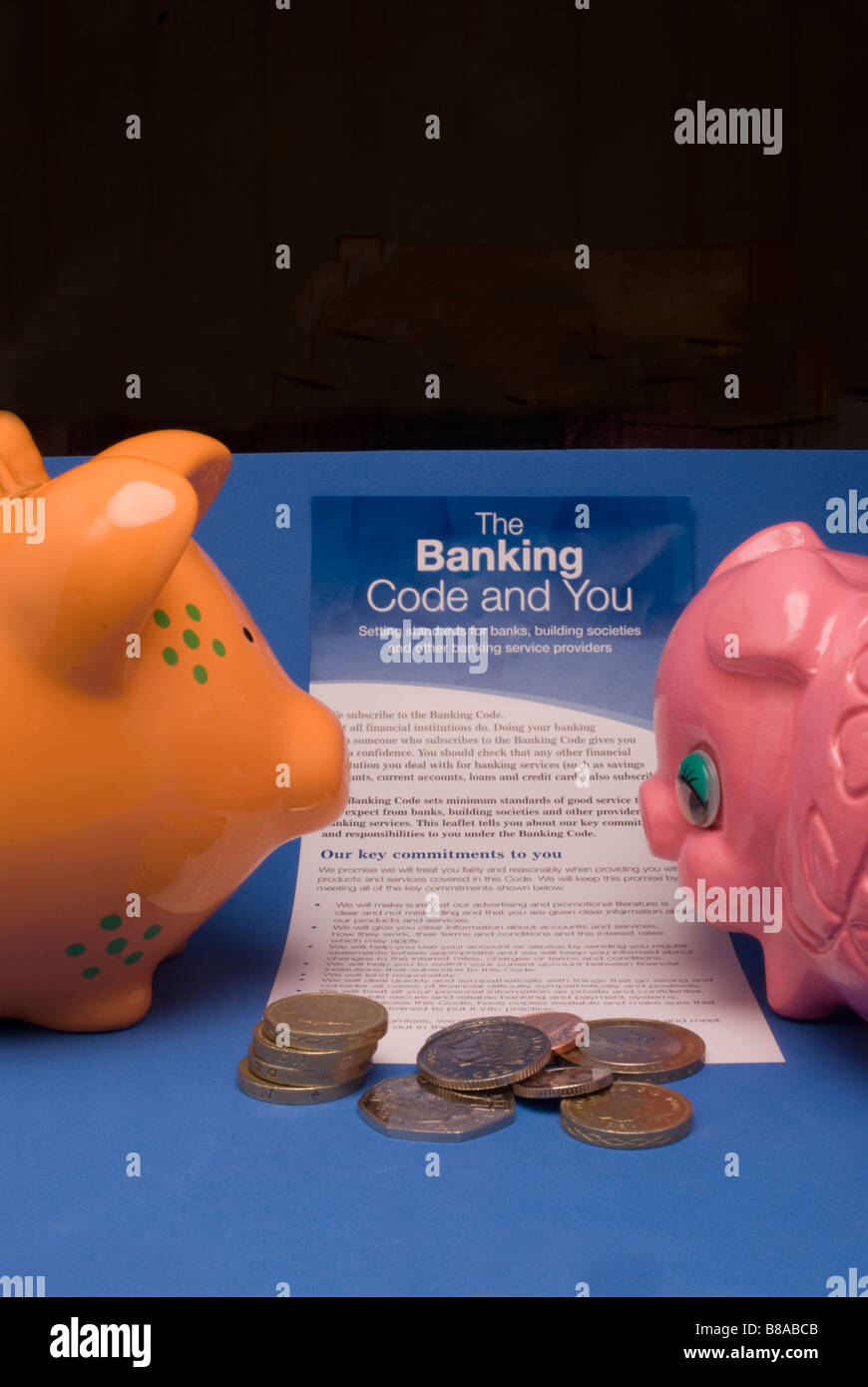 Two piggy banks and the Banking Code Stock Photo Alamy