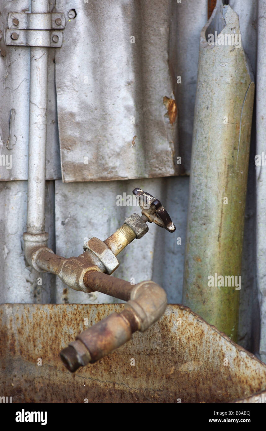 An old rusty pipe and sink Stock Photo Alamy