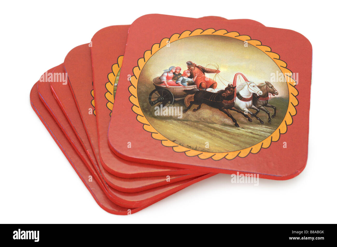 Coasters, image depicts traditional Russian theme, Peasants in a Troika (three horse carriage). Stock Photo