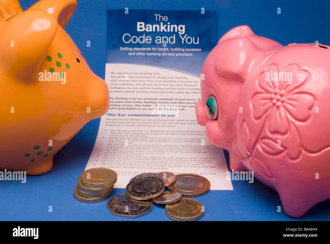 Two piggy banks and the Banking Code Stock Photo Alamy