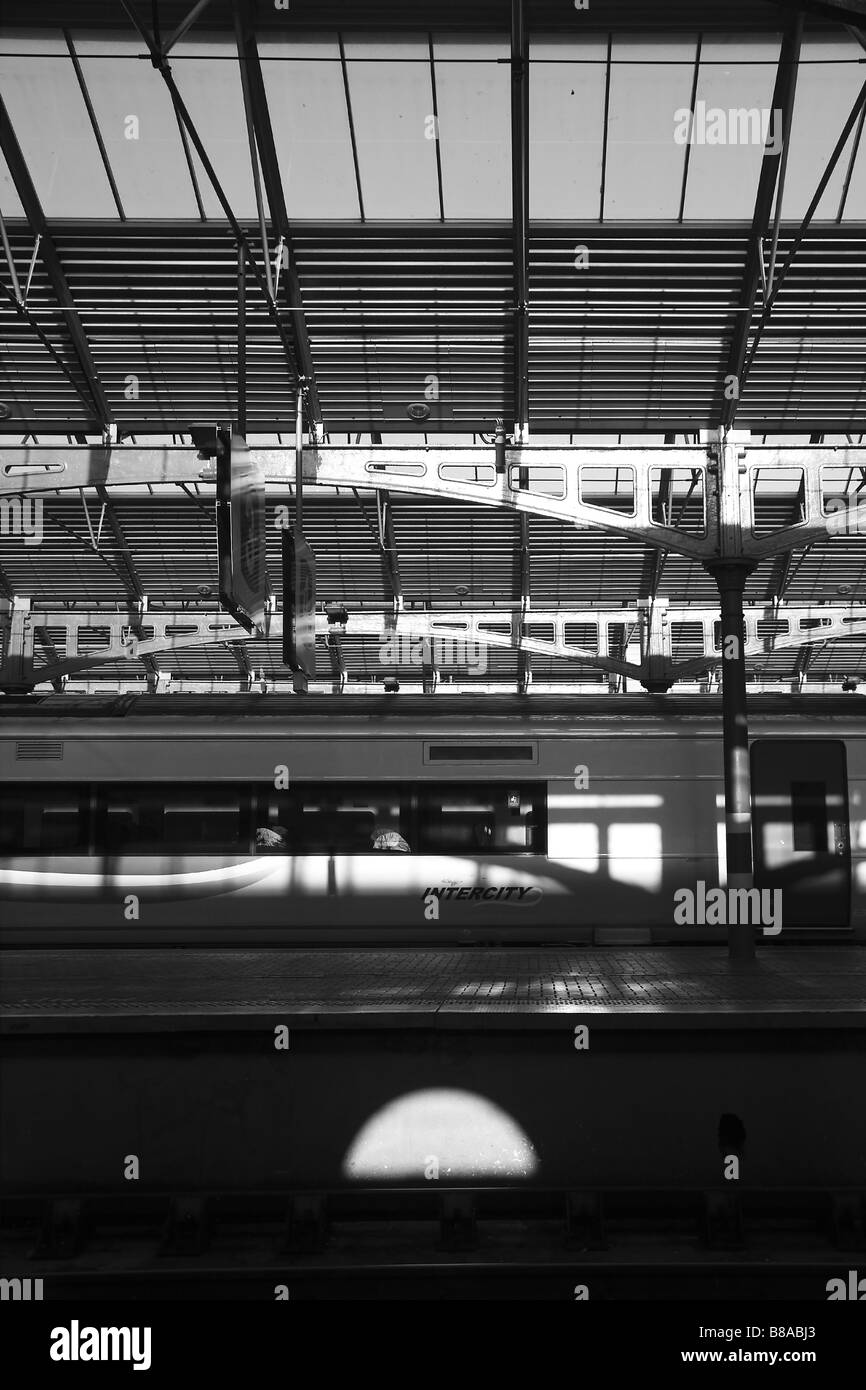 train docked at the railway station, black and white photograph showing play of shadow and light Stock Photo