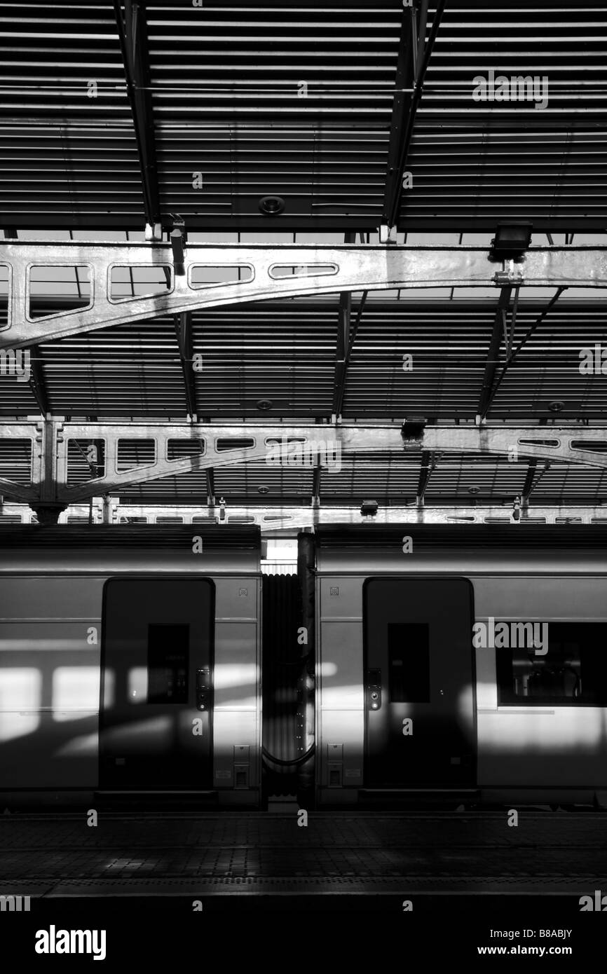 train docked at the railway station, black and white photograph showing play of shadow and light Stock Photo