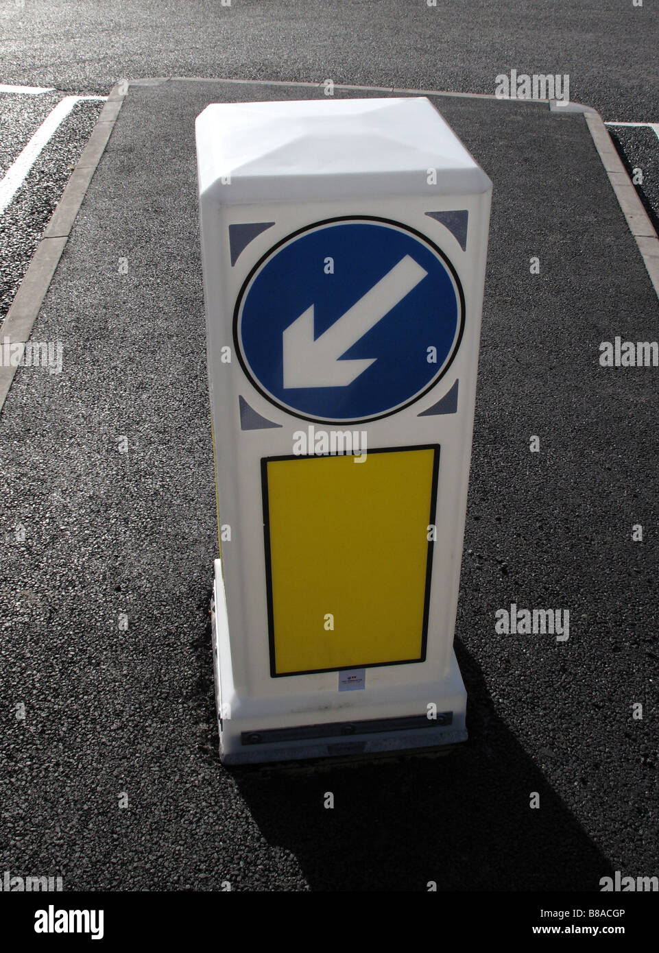 Keep left traffic bollard in the centre of new road Stock Photo