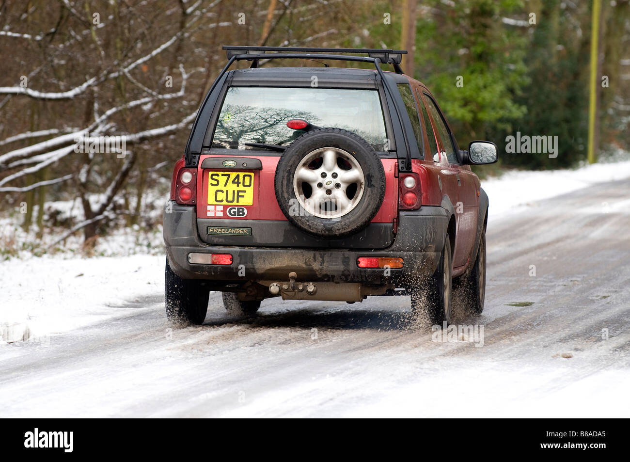 1998 Land Rover Freelander driving on icy snowyroad Stock Photo