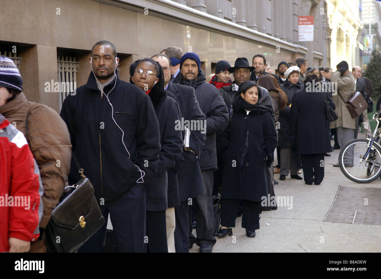 Hundreds of people line up in New York for a job fair sponsored by the website CareerBuilder Stock Photo