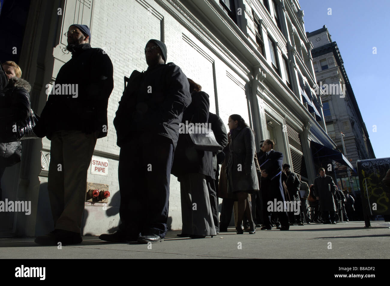 Hundreds of people line up in New York for a job fair sponsored by the website CareerBuilder Stock Photo