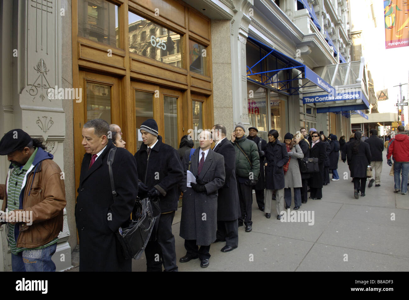 Hundreds of people line up in New York for a job fair sponsored by the website CareerBuilder Stock Photo