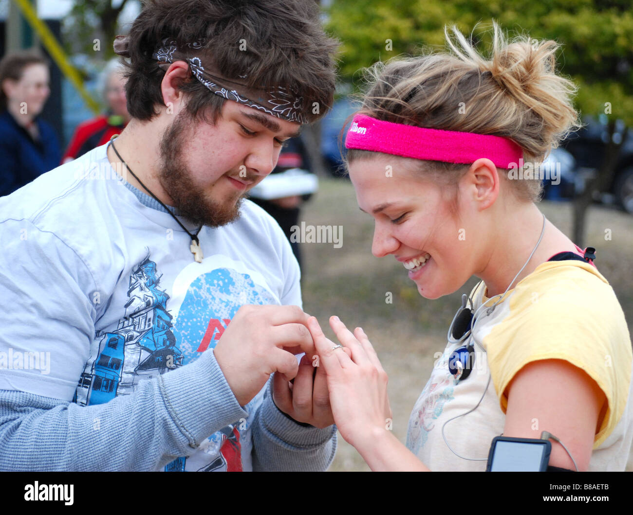 Happy couple looking at wedding ring Stock Photo