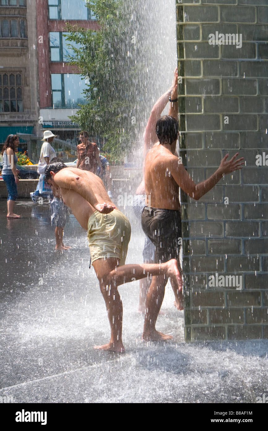 Kids play in Jaume Plensa's Crown Fountain in Millennium Park Chicago Illinois Stock Photo