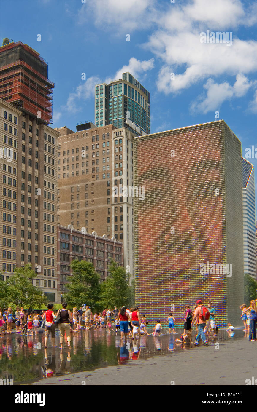 Children and families play in Jaume Plensa's Crown Fountain in Millennium Park Chicago Illinois Stock Photo