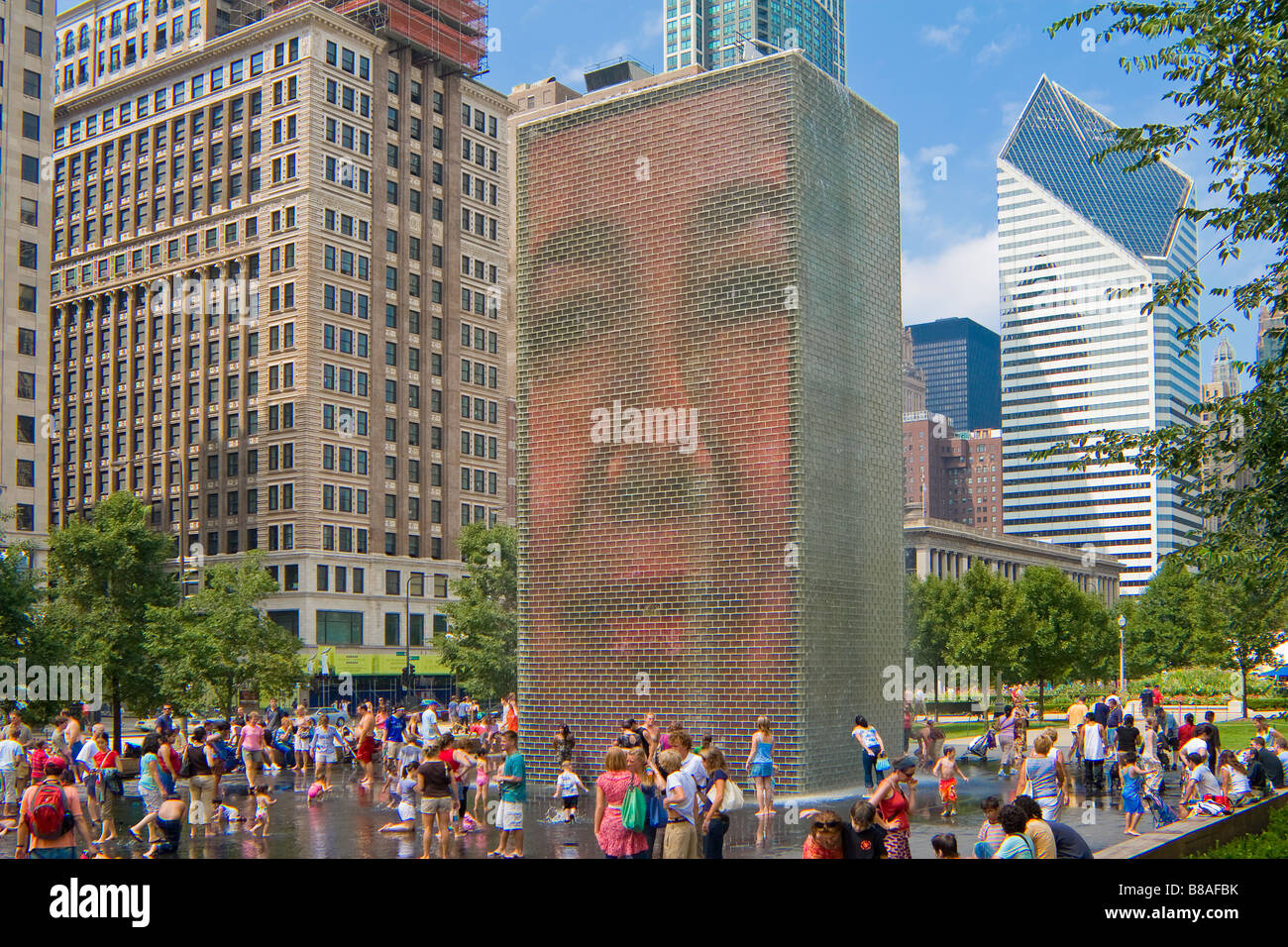 Children and families play in Jaume Plensa's Crown Fountain in Millennium Park Chicago Illinois Stock Photo