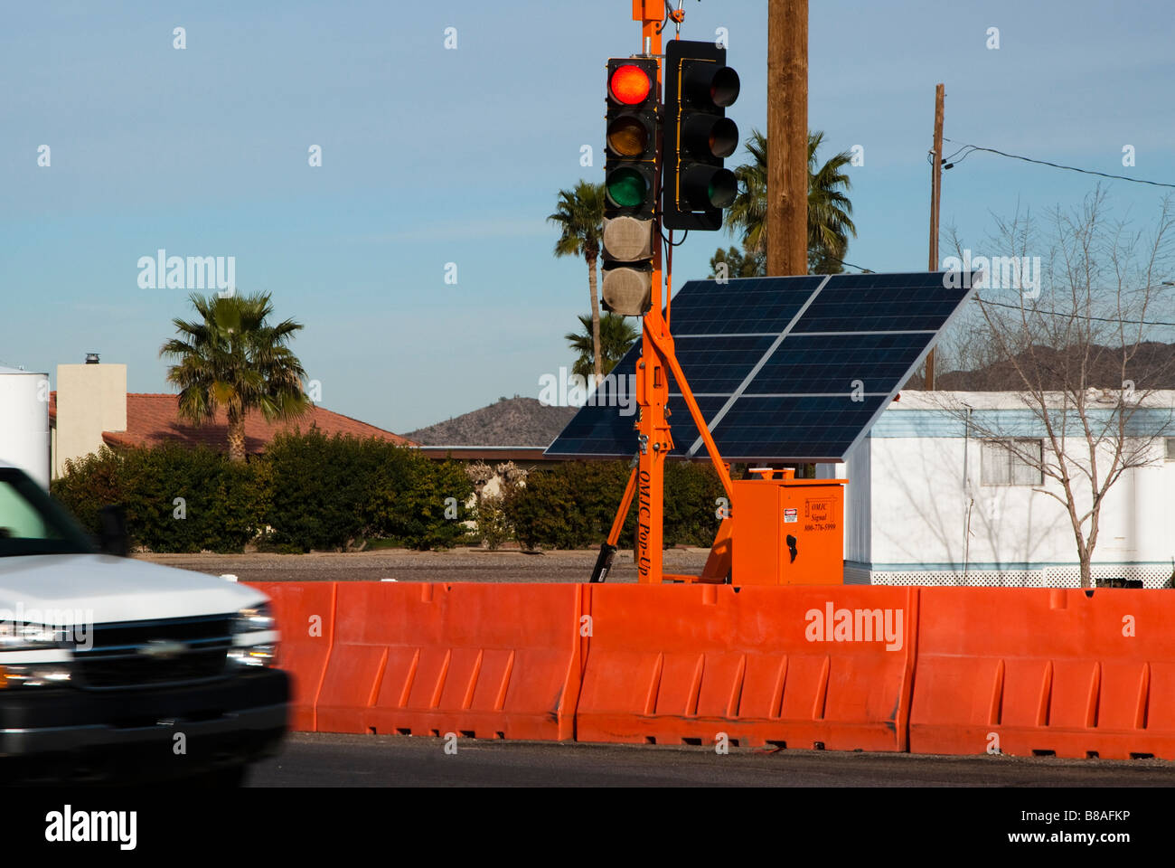 temporary solar powered traffic control lights at a street intersection Stock Photo