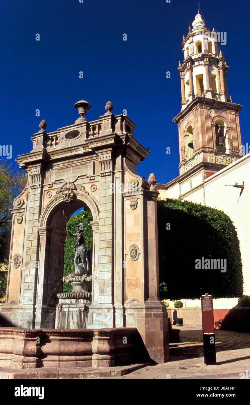 Fountain of Neptune with the steeple of Templo Santa Clara in the background. Located in Queretaro, Mexico Stock Photo