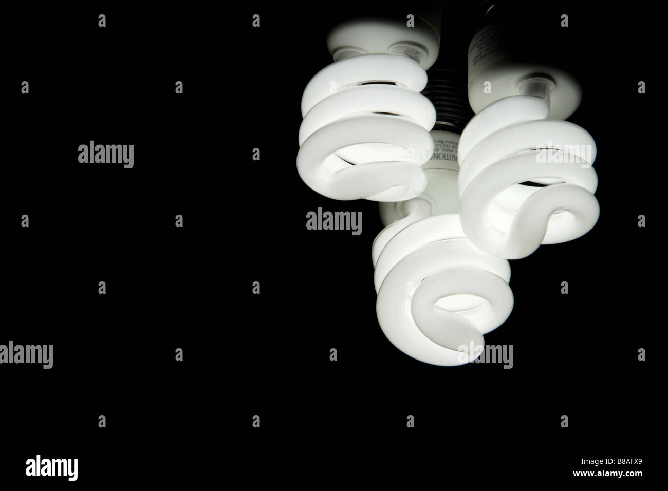 A green fluorescent energy saving light bulb Stock Photo - Alamy
