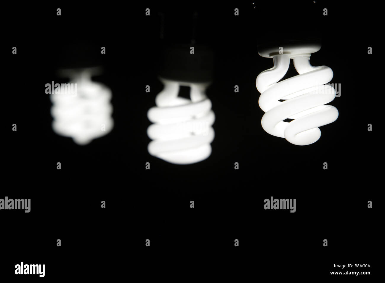 A green fluorescent energy saving light bulb Stock Photo - Alamy