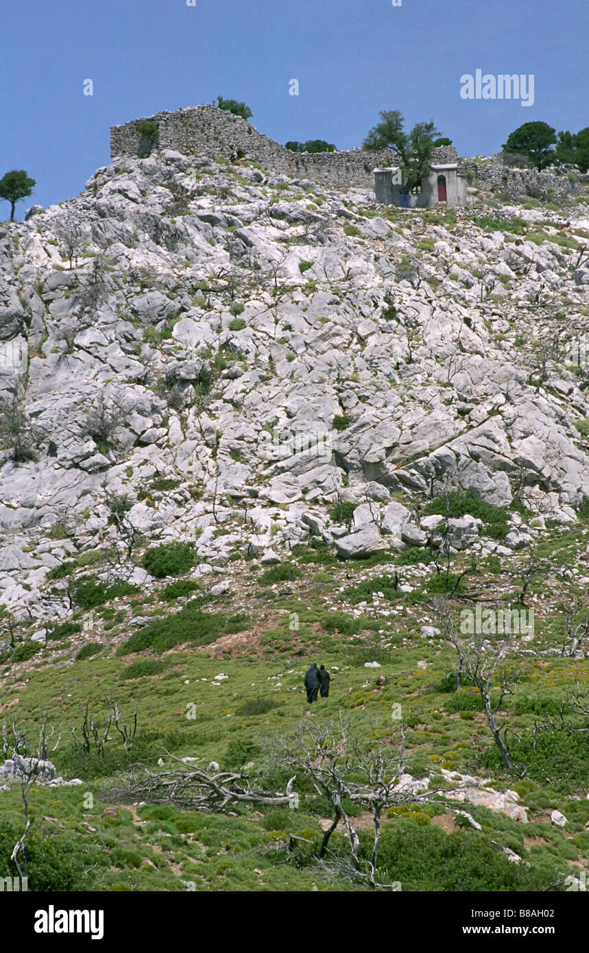 Nuns ascending to a church in the mountains near Kimi, Evoia, Greece Stock Photo