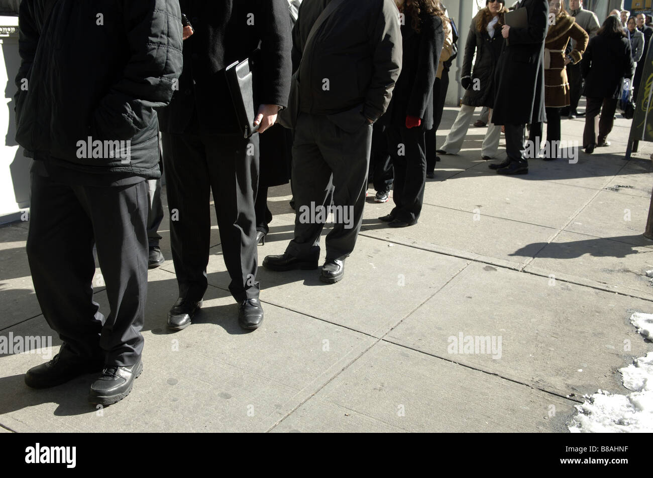 Hundreds of people line up in New York for a job fair sponsored by the website CareerBuilder Stock Photo