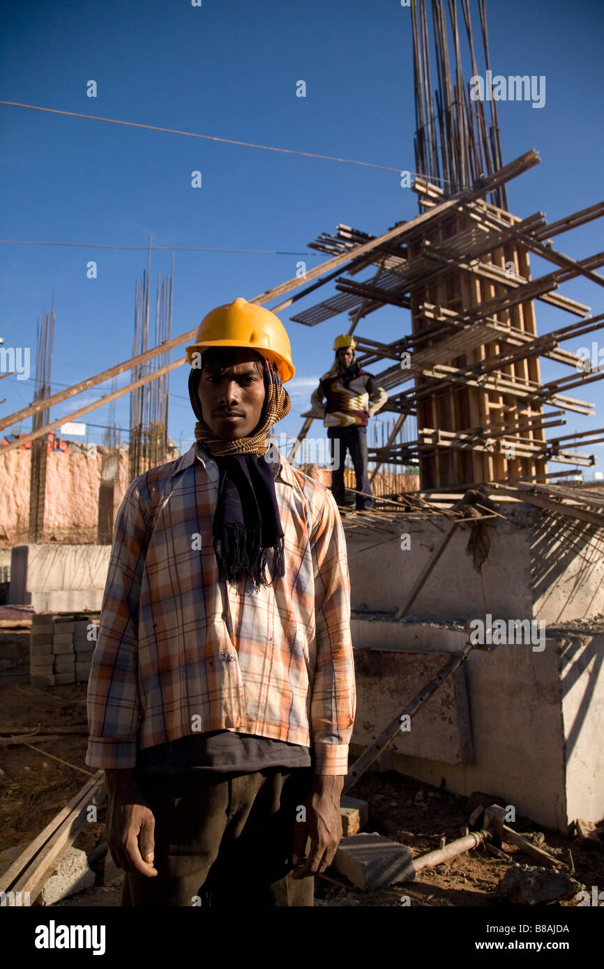 A worker wears a safety helmet on a construction site in Bangalore