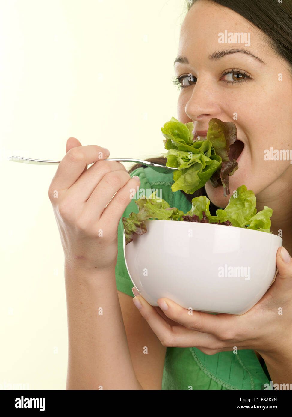 Young Woman Eating Green Salad Model Released Stock Photo Alamy