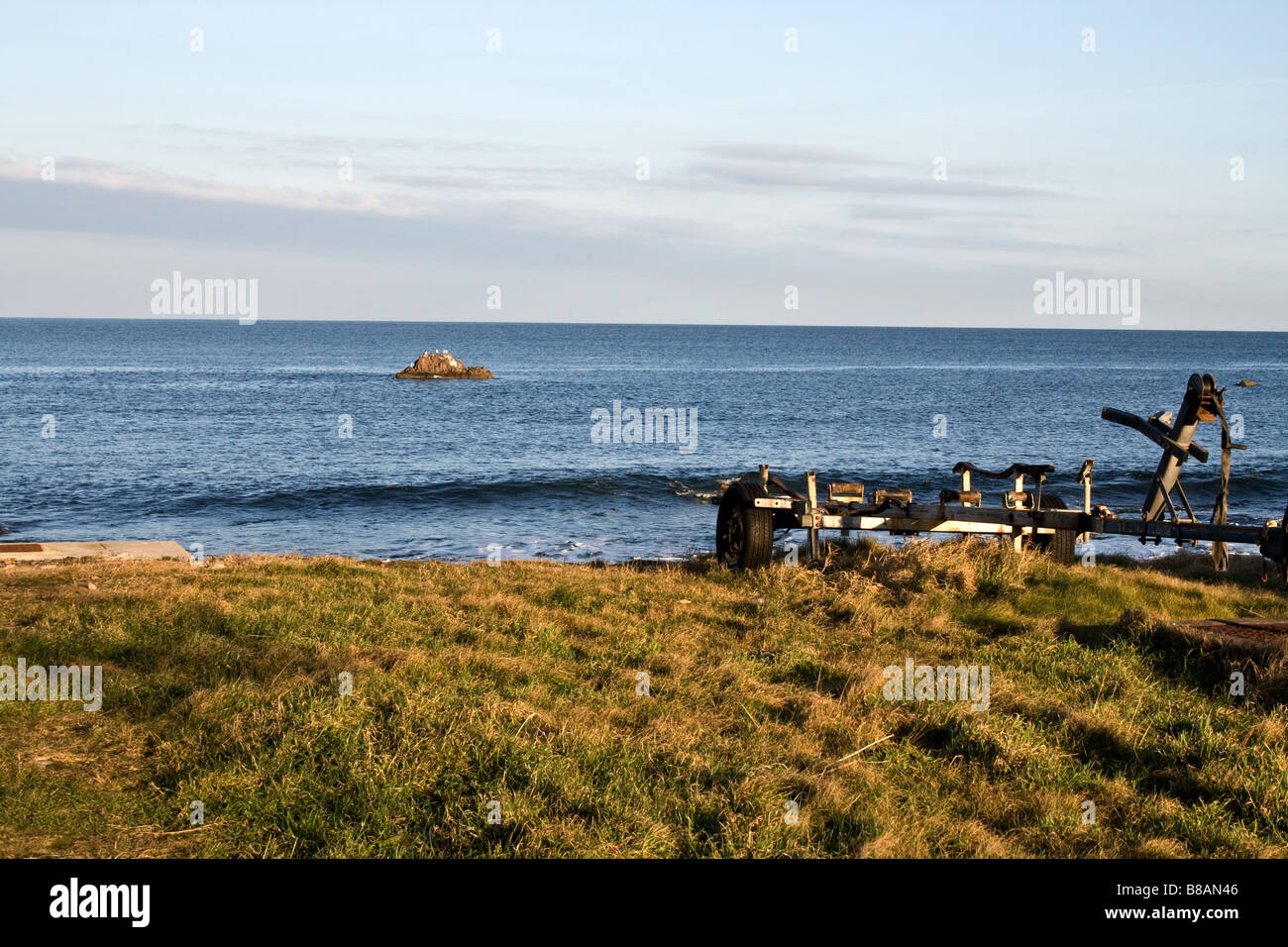 Empty boat trailer by the water overlooking the Moray Firth in Findochty, Scotland Stock Photo