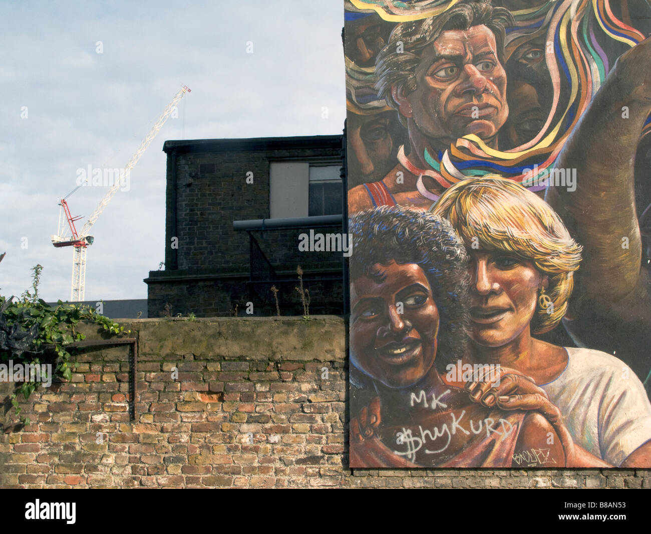 CRANES BUILDING EAST LONDON LINE EXTENSION AND COMMUNITY MURAL IN HACKNEY ,LONDON,ENGLAND Photo © Julio Etchart Stock Photo